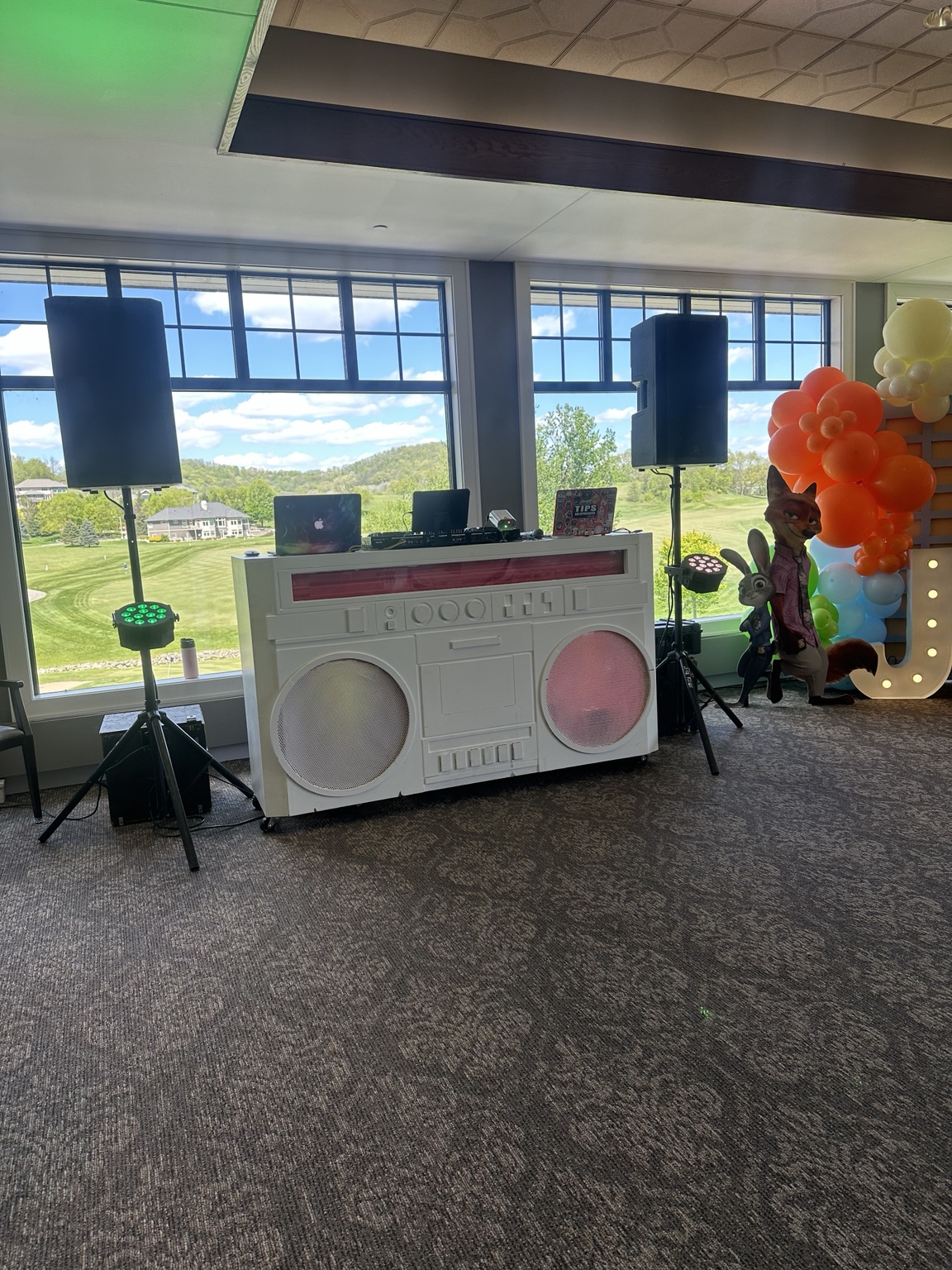 Real Rustic Memories DJ booth and speaker setup at an event