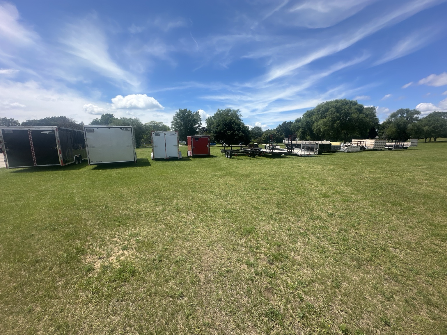 Real trailers and equipment stored in the outdoor area at Rustic Memories